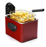 Friteuse rouge avec panier de frites.