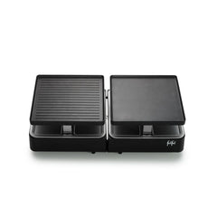 Grill électrique double Raclette Gourmet noir, doté de deux surfaces de cuisson indépendantes — l’une striée, l’autre lisse — et d’un revêtement en céramique sans PFAS pour des repas plus sains, présenté sur un fond blanc.